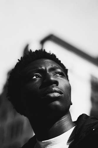 black-and-white grayscale photography of man new york
